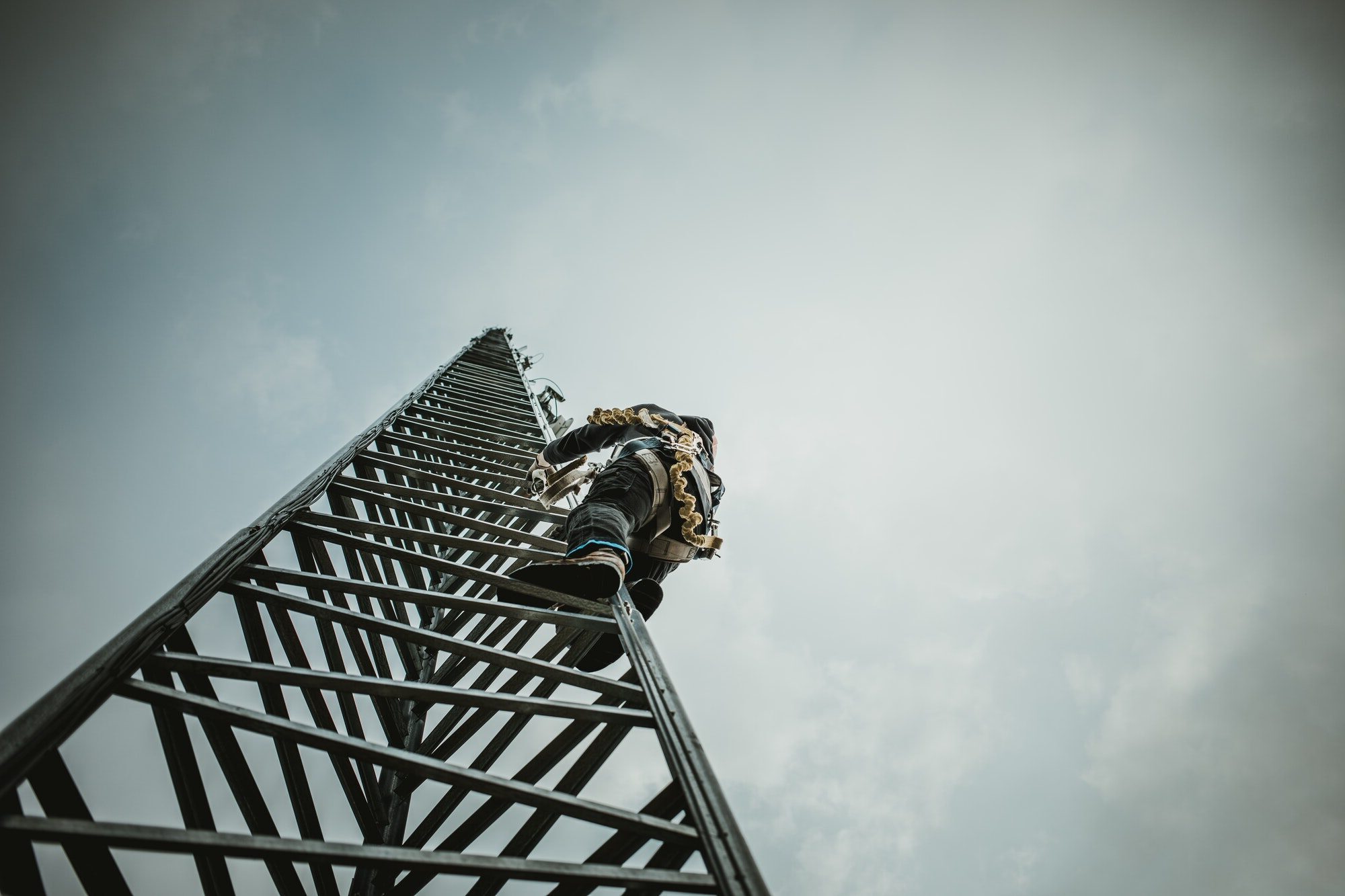 Telecom Worker Climbing Antenna Tower